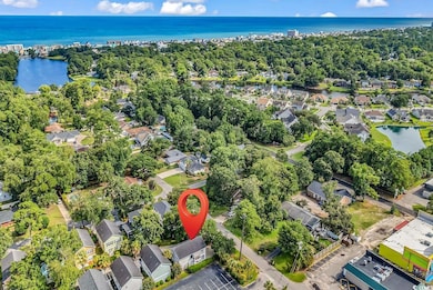 Aerial overview of property's location with nearby suburban area and a large body of water