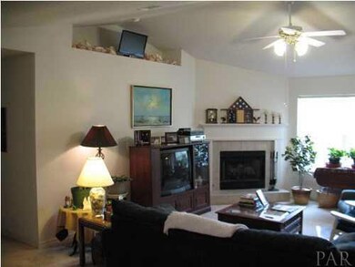 Great Room with gas fireplace and plant ledges.