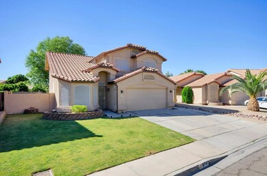 5741 W Comet Ave-large-003-28-Front Exte