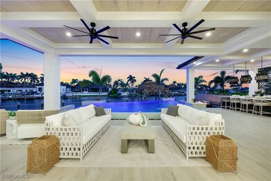 Pool at dusk with ceiling fan, an outdoor hangout