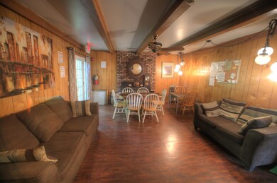 Sitting/dining area with character and wooden charm.
