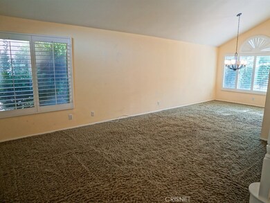 Large formal living room just off dining room with shutters throughout