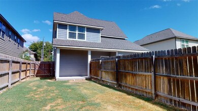 Back of property with a yard
