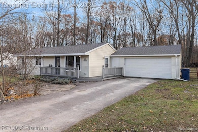 Single story home featuring a shingled roof and covered porch