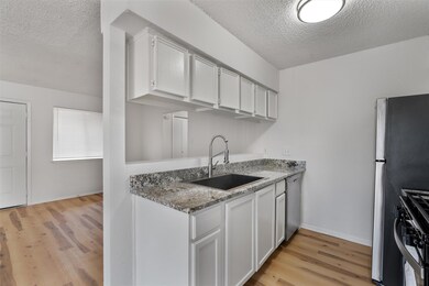 Kitchen featuring stainless steel appliances, a t