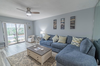 Living room featuring hardwood / wood-style floori