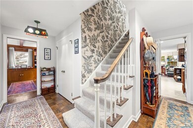 Entry hall. Hardwood flooring.  Large Guest Closet