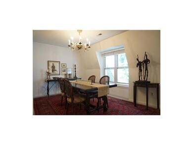 Light filled dining room with treetop views.