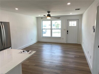 Entryway with dark hardwood / wood-style flooring,