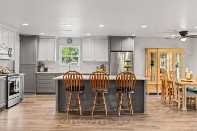Kitchen featuring stainless steel appliances, gra