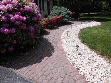 brick and stone sidewalk adds to the home's beauty