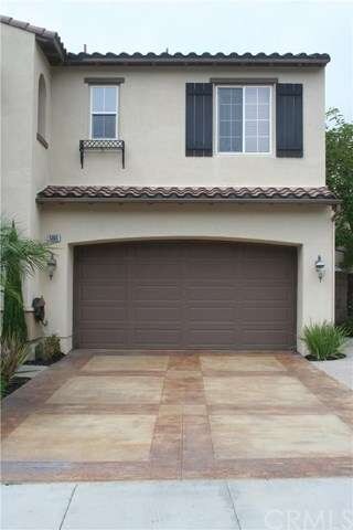 Custom driveway leads to 3 car tandem garage