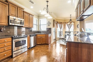 Gourmet kitchen with stainless steel appliances.