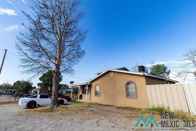 View of side of property with stucco siding and a cooling unit
