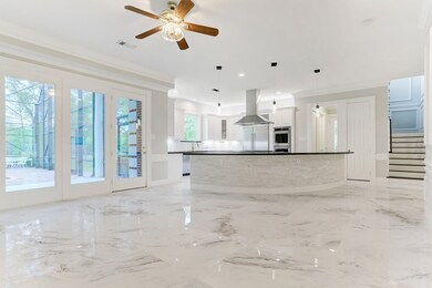 A wall of windows allows you to enjoy a view of the pool area as you relax in the kitchen