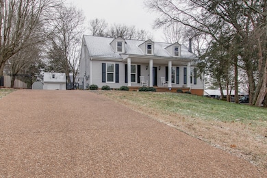 Pull into the drive and stroll up to the covered porch.