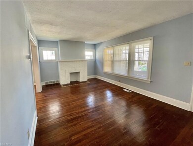 The living room is spacious and offers different options for your furniture set up.