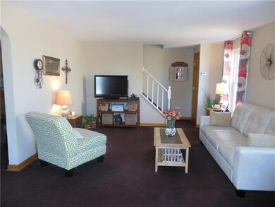 The living room is freshly painted with new carpet