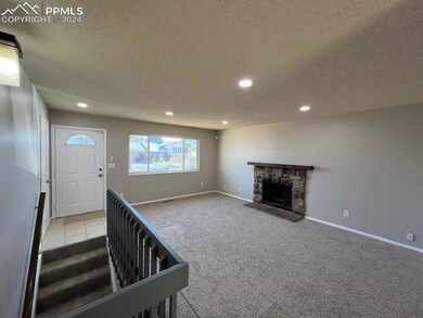 Unfurnished living room featuring light carpet, a 