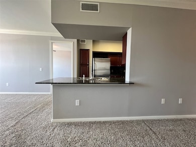 This view shows how the kitchen is open to the liv