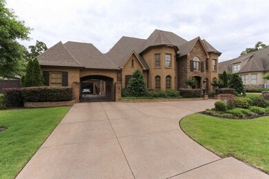 Gated Porte-cochere leads to Spacious 3 Car Garage