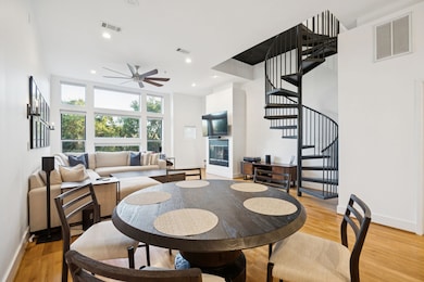 Dining space featuring stairs, light wood-style floors, recessed lighting, and ceiling fan