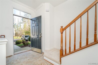 Entrance foyer with ornamental molding and light c