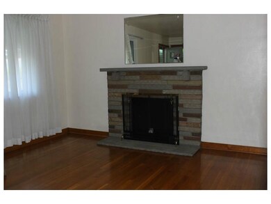 Living Room. Hardwood floors and stone decorative 
