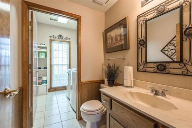 Half bath, sunny laundry room on family room level