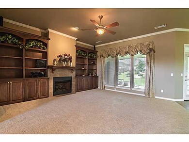 Living Room. The windows across back are covered w