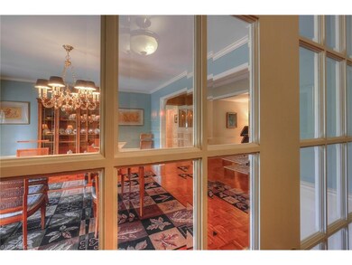 French doors off of foyer looking into the dining 