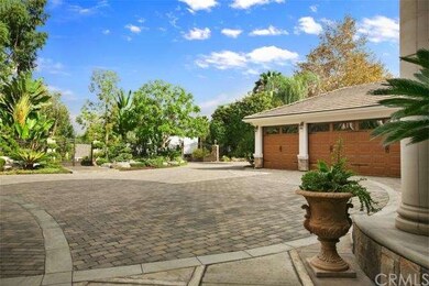 Custom designed brick circular driveway with plent