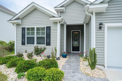 Entrance to property with an attached garage