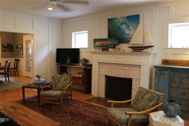 Living room with operating gas logs & ample natura