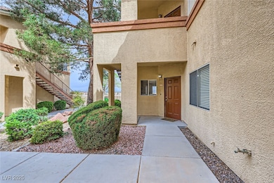 View of exterior entry with stucco siding