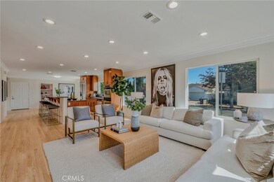 Great Room - open living space with abundant natural light, refinished hardwood floors