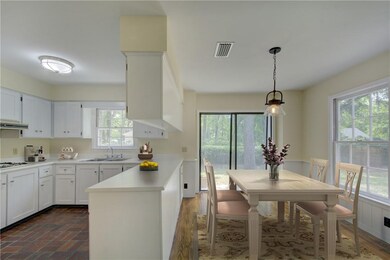 Eat-in kitchen dining that opens to the back deck