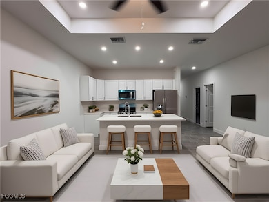 Living area featuring recessed lighting, light wood-style floors, and ceiling fan