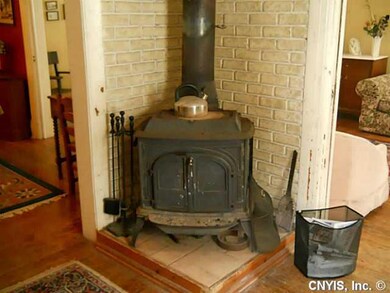 Living Room. Wood sstove warms the parlor.