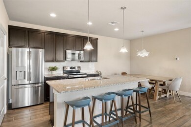Kitchen featuring appliances with stainless steel