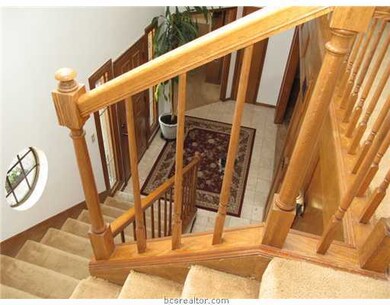 Other. Wide staircase with oak-trimed accents.