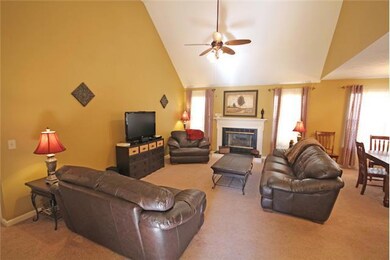 Great Room with Fireplace and Vaulted Ceiling