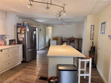 Kitchen with freestanding refrigerator, a breakfas