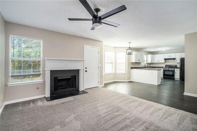 Unfurnished living room with a textured ceiling, a