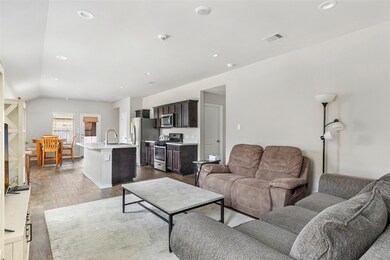 Light and bright throughout main living areas! Lam
