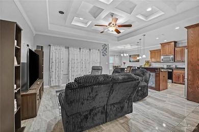 Living area with ornamental molding, a ceiling fan, a chandelier, light marble finish floors, and recessed lighting