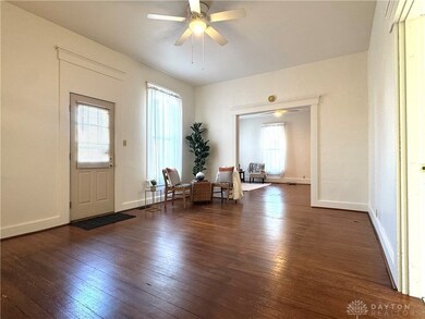 Living/bonus room with beautiful hard wood floors.
