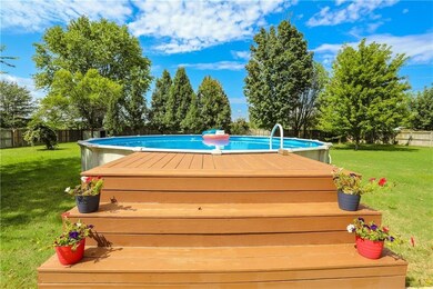 Above ground vinyl pool w/deck - photo taken in summer