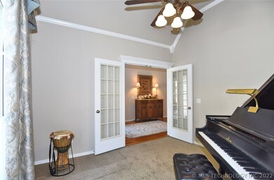French doors lead to this office/music room with v