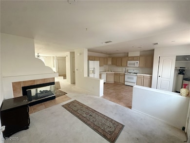 Kitchen with light tile patterned flooring, light
